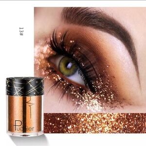 Dramatic Gold Eyeshadow with Glitter and Voluminous Lashes